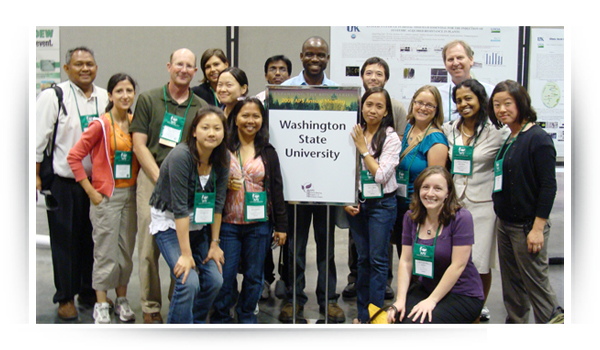 Faculty and students representing WSU at a poster presentation